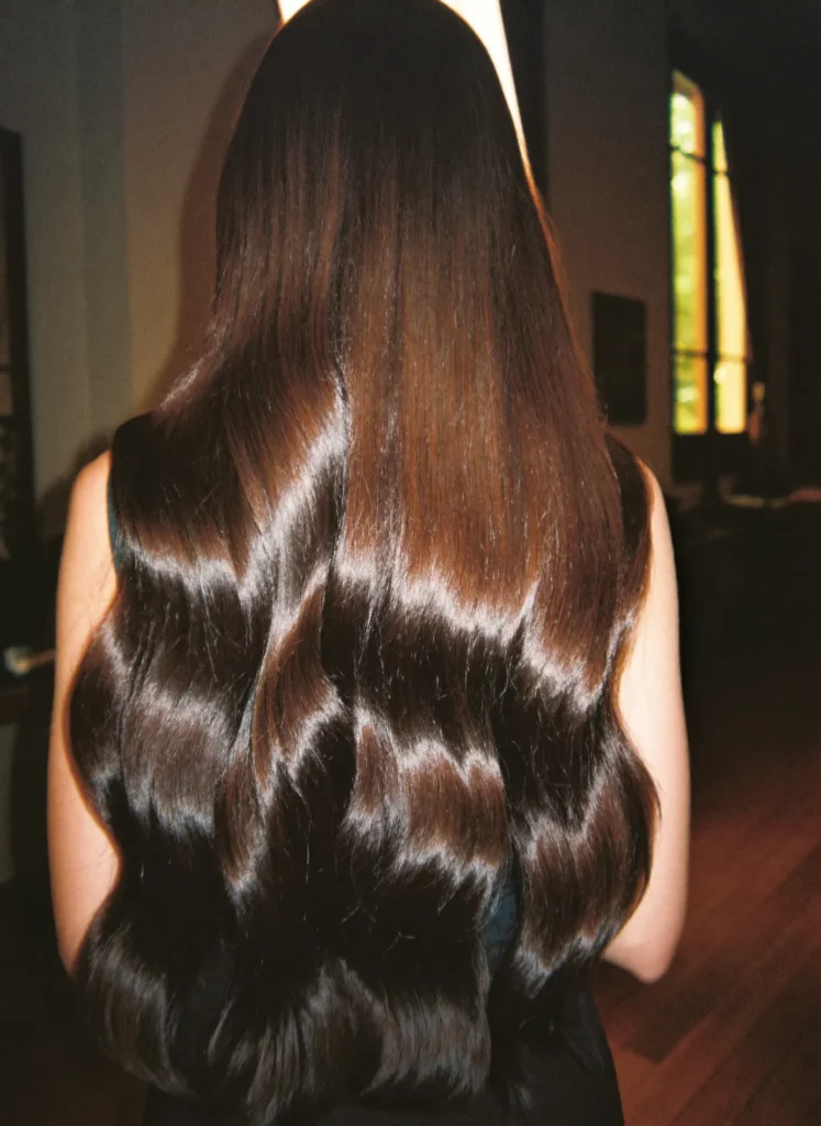 Long glossy wavy hair seen from behind