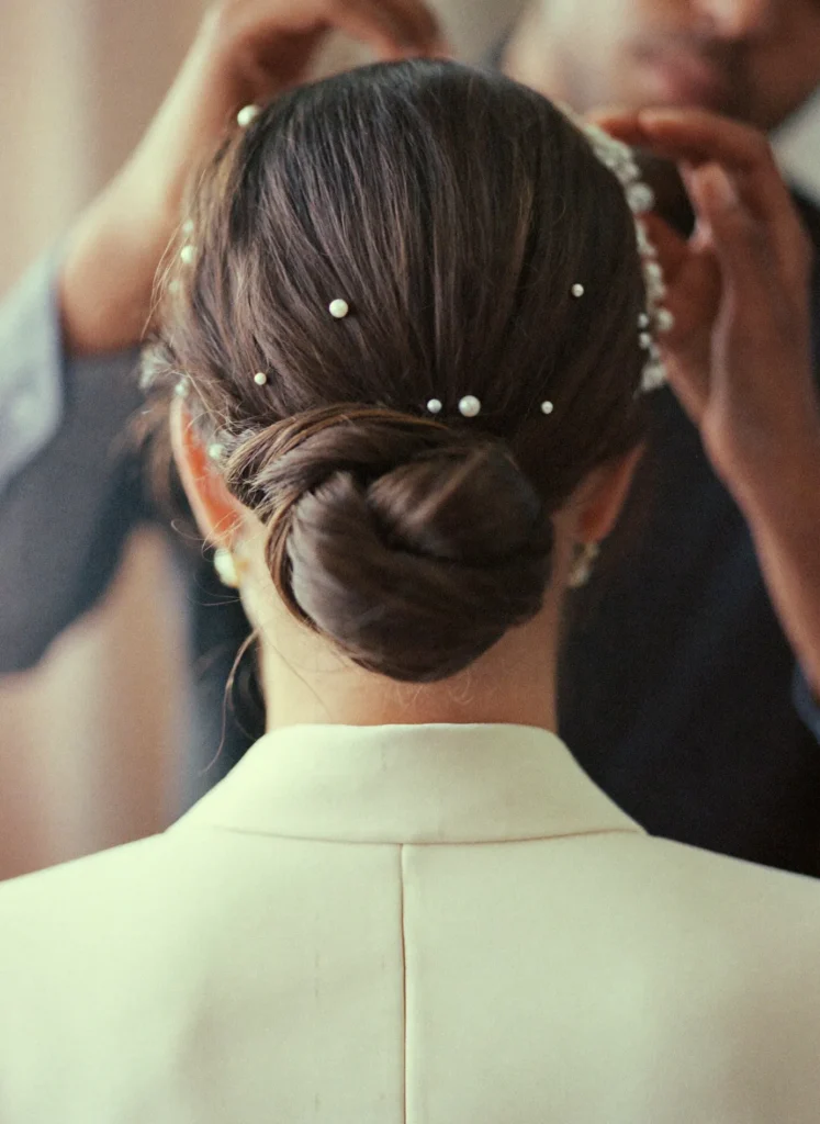 Bride with a low chignon and pearl pins